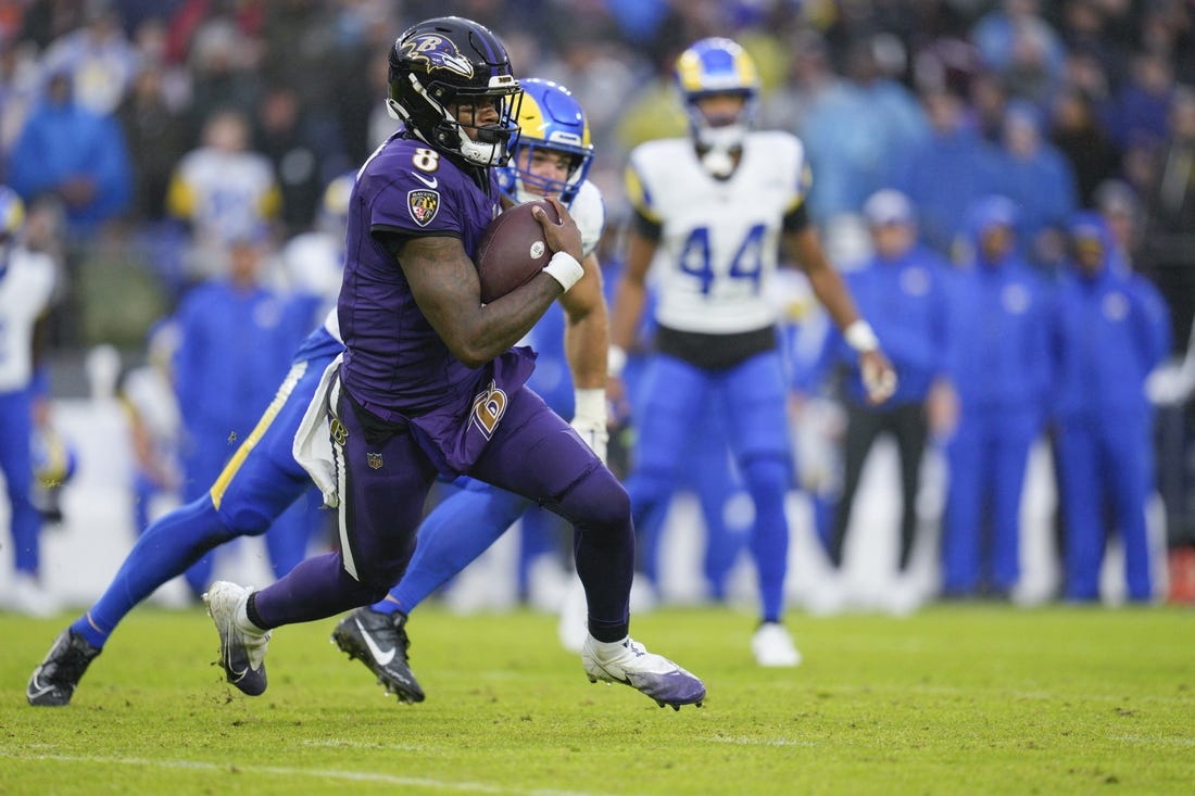 Dec 10, 2023; Baltimore, Maryland, USA;  Baltimore Ravens quarterback Lamar Jackson (8) runs with the ball against the Los Angeles Rams during the second half at M&T Bank Stadium. Mandatory Credit: Jessica Rapfogel-USA TODAY Sports