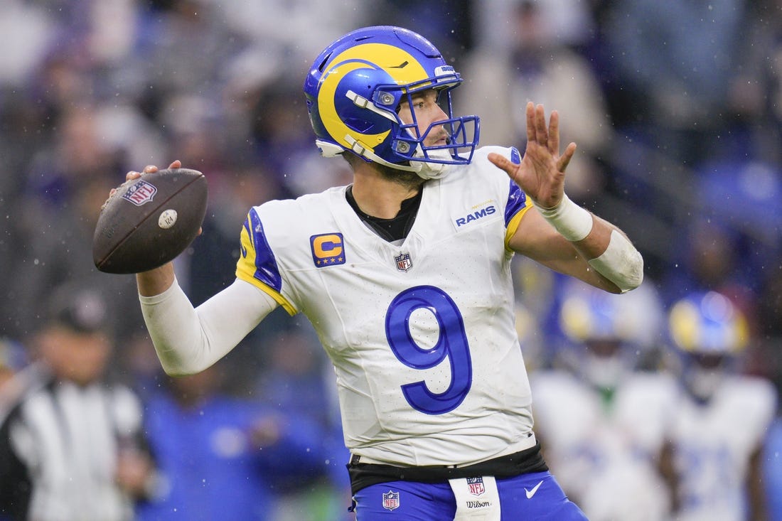 Dec 10, 2023; Baltimore, Maryland, USA;  Los Angeles Rams quarterback Matthew Stafford (9) passses against the Baltimore Ravens during the second half at M&T Bank Stadium. Mandatory Credit: Jessica Rapfogel-USA TODAY Sports