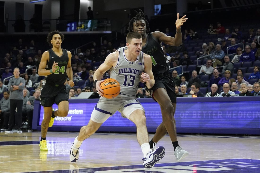 Dec 13, 2023; Evanston, Illinois, USA; Chicago State Cougars guard Wesley Cardet Jr. (1) defends Northwestern Wildcats guard Brooks Barnhizer (13) during the first half at Welsh-Ryan Arena. Mandatory Credit: David Banks-USA TODAY Sports