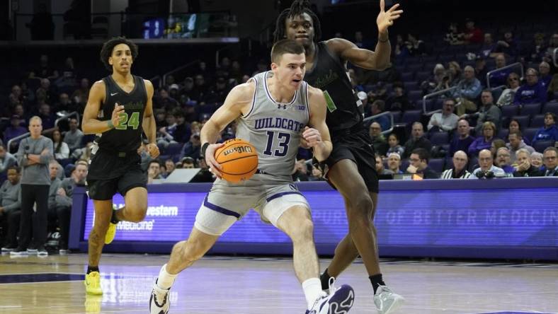 Dec 13, 2023; Evanston, Illinois, USA; Chicago State Cougars guard Wesley Cardet Jr. (1) defends Northwestern Wildcats guard Brooks Barnhizer (13) during the first half at Welsh-Ryan Arena. Mandatory Credit: David Banks-USA TODAY Sports