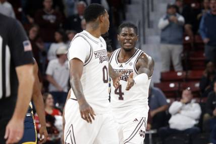 Dec 13, 2023; Starkville, Mississippi, USA; Mississippi State Bulldogs forward Cameron Matthews (4) reacts with Mississippi State Bulldogs forward D.J. Jeffries (0) during the second half against the Murray State Racers at Humphrey Coliseum. Mandatory Credit: Petre Thomas-USA TODAY Sports