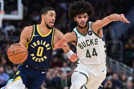Dec 13, 2023; Milwaukee, Wisconsin, USA;  Indiana Pacers guard Tyrese Haliburton (0) drives for the basket against Milwaukee Bucks guard Andre Jackson Jr. (44) in the second quarter at Fiserv Forum. Mandatory Credit: Benny Sieu-USA TODAY Sports