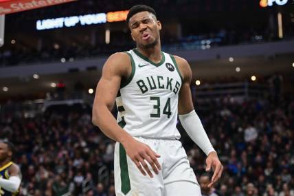 Dec 13, 2023; Milwaukee, Wisconsin, USA; Milwaukee Bucks forward Giannis Antetokounmpo (34) reacts after scoring a basket in the third quarter against the Indiana Pacers at Fiserv Forum. Mandatory Credit: Benny Sieu-USA TODAY Sports