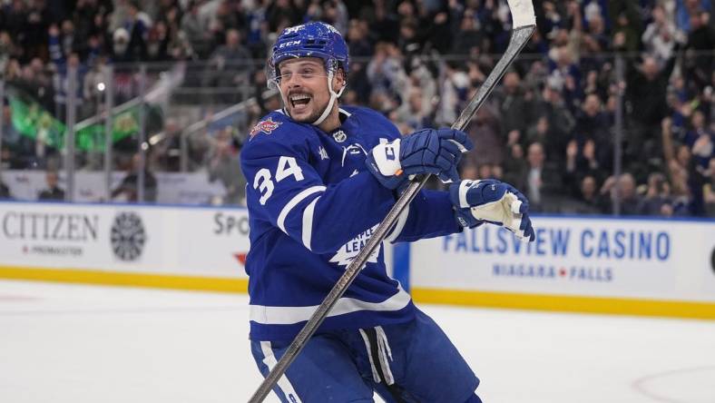 Dec 14, 2023; Toronto, Ontario, CAN; Toronto Maple Leafs forward Auston Matthews (34) reacts after scoring the tying goal to send the game to overtime against the Columbus Blue Jackets during the third period at Scotiabank Arena. Mandatory Credit: John E. Sokolowski-USA TODAY Sports