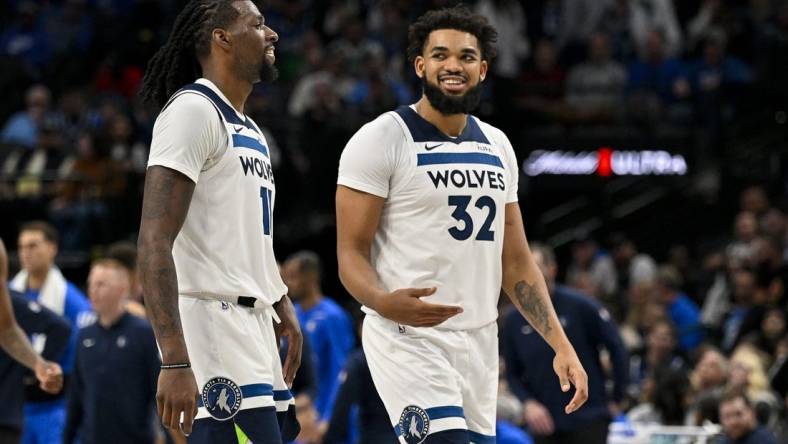 Dec 14, 2023; Dallas, Texas, USA; Minnesota Timberwolves center Naz Reid (11) and center Karl-Anthony Towns (32) walk off the court during the second half against the Dallas Mavericks at the American Airlines Center. Mandatory Credit: Jerome Miron-USA TODAY Sports