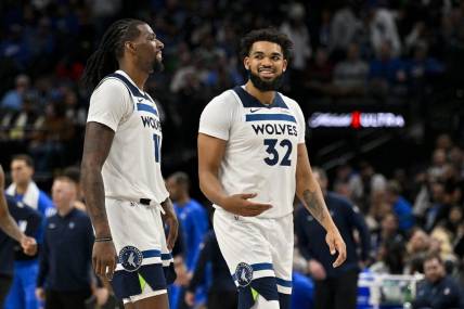 Dec 14, 2023; Dallas, Texas, USA; Minnesota Timberwolves center Naz Reid (11) and center Karl-Anthony Towns (32) walk off the court during the second half against the Dallas Mavericks at the American Airlines Center. Mandatory Credit: Jerome Miron-USA TODAY Sports