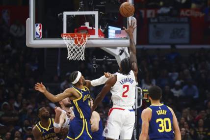 Dec 14, 2023; Los Angeles, California, USA; LA Clippers forward Kawhi Leonard (2) makes a layup during the first half of the game against the Golden State Warriors at Crypto.com Arena. Mandatory Credit: Jessica Alcheh-USA TODAY Sports
