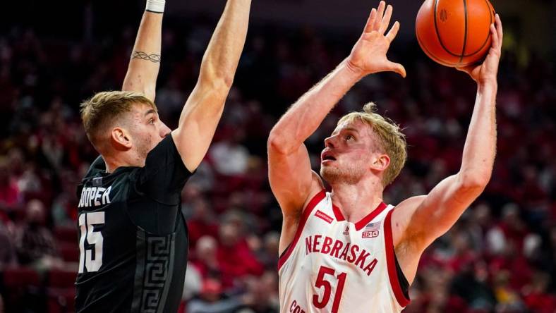 Dec 10, 2023; Lincoln, Nebraska, USA; Nebraska Cornhuskers forward Rienk Mast (51) shoots the ball against Michigan State Spartans center Carson Cooper (15) during the first half at Pinnacle Bank Arena. Mandatory Credit: Dylan Widger-USA TODAY Sports