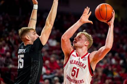 Dec 10, 2023; Lincoln, Nebraska, USA; Nebraska Cornhuskers forward Rienk Mast (51) shoots the ball against Michigan State Spartans center Carson Cooper (15) during the first half at Pinnacle Bank Arena. Mandatory Credit: Dylan Widger-USA TODAY Sports