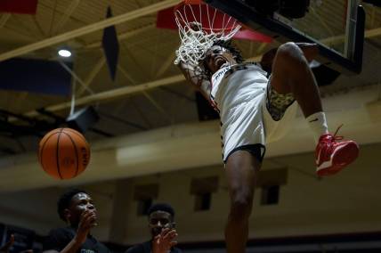 Grovetown shooting guard Derrion Reid (35) dunks the ball during the Grovetown and Brunswick Region 2 AAAAAA championship game at Grovetown High School on Saturday, Feb. 18, 2023. Grovetown defeated Brunswick 89-55.