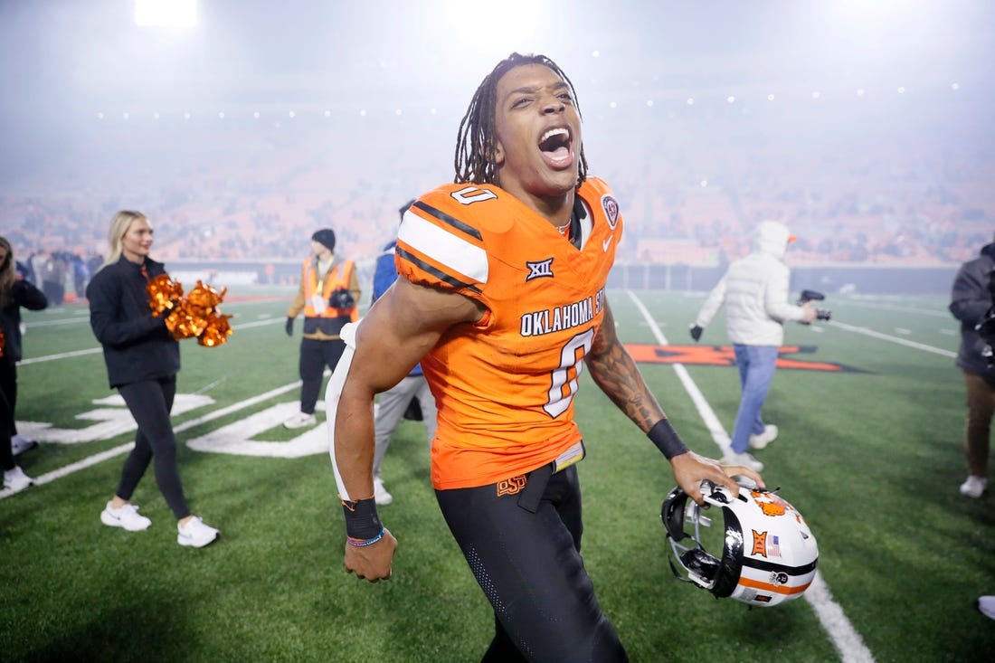 Oct 28, 2023; Stillwater, Oklahoma, USA; Oklahoma State Cowboys running back Ollie Gordon II (0) celebrates after a college football game between Oklahoma State and Cincinnati at Boone Pickens Stadium. Oklahoma State won 45-13.