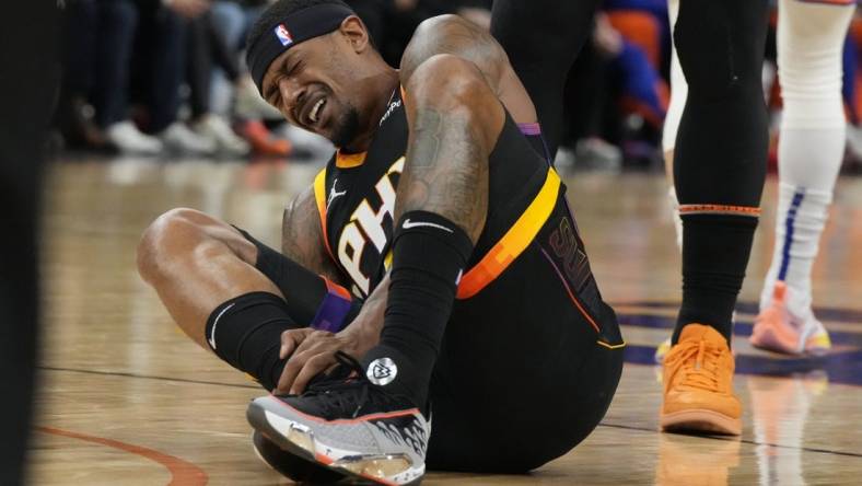 Dec 15, 2023; Phoenix, Arizona, USA; Phoenix Suns guard Bradley Beal (3) reacts after getting hurt against the New York Knicks in the first half at Footprint Center. Mandatory Credit: Rick Scuteri-USA TODAY Sports