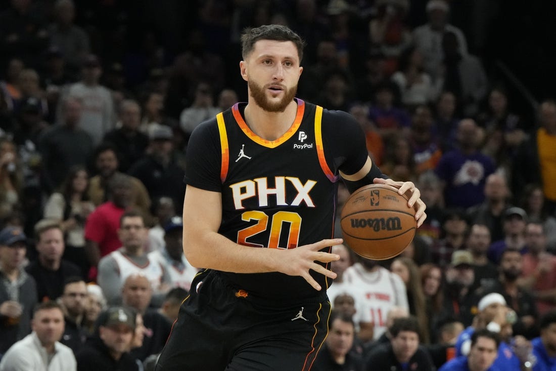 Dec 15, 2023; Phoenix, Arizona, USA; Phoenix Suns center Jusuf Nurkic (20) drives on the New York Knicks in the second half at Footprint Center. Mandatory Credit: Rick Scuteri-USA TODAY Sports