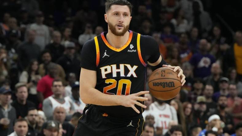 Dec 15, 2023; Phoenix, Arizona, USA; Phoenix Suns center Jusuf Nurkic (20) drives on the New York Knicks in the second half at Footprint Center. Mandatory Credit: Rick Scuteri-USA TODAY Sports