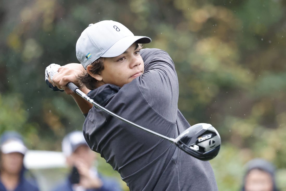 Dec 16, 2023; Orlando, Florida, USA; Charlie Woods plays his shot from the sixth tee during the PNC Championship at The Ritz-Carlton Golf Club. Mandatory Credit: Reinhold Matay-USA TODAY Sports