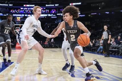 Dec 16, 2023; New York, New York, USA;  Georgia Tech Yellow Jackets guard Naithan George (2) drives past Penn State Nittany Lions forward Leo O'Boyle (11) in the first half at Madison Square Garden. Mandatory Credit: Wendell Cruz-USA TODAY Sports