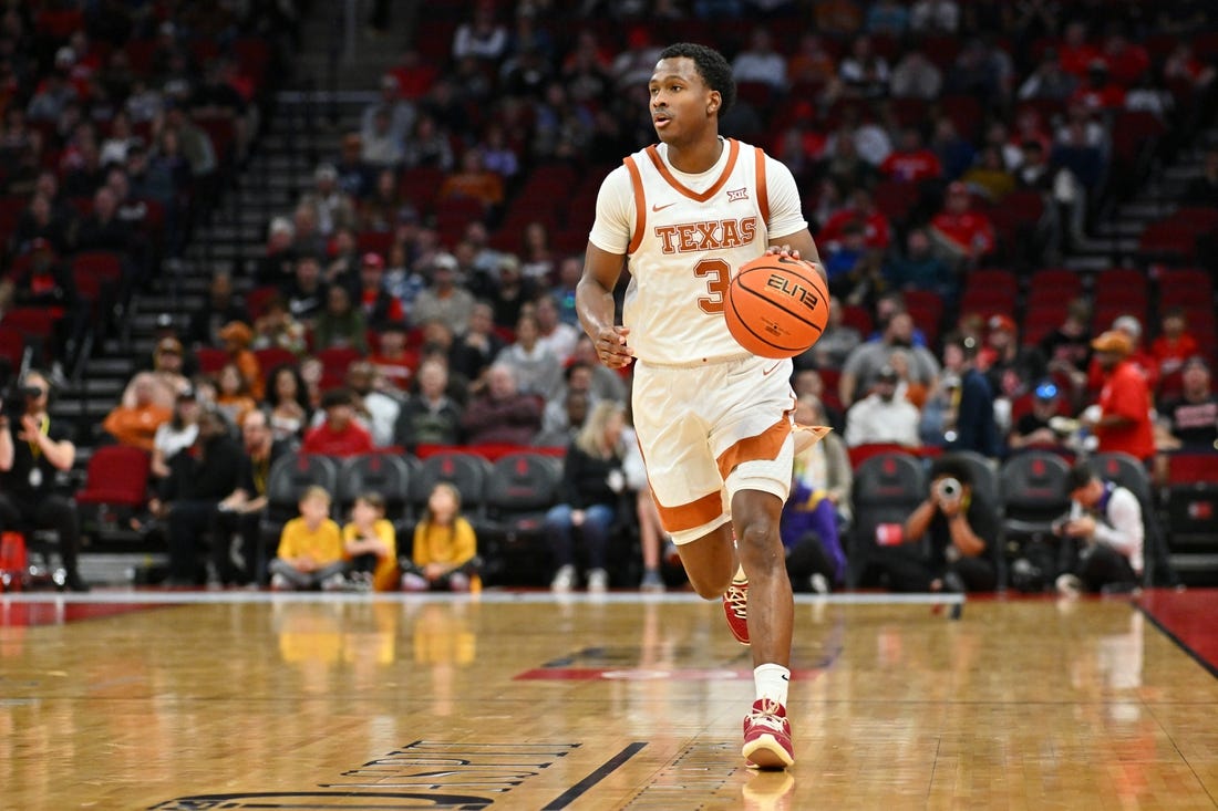 Dec 16, 2023; Houston, Texas, USA; Texas Longhorns guard Max Abmas (3) dribbles the ball against the LSU Tigers during the first half at Toyota Center. Mandatory Credit: Maria Lysaker-USA TODAY Sports