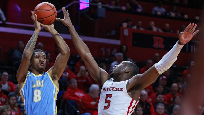 Dec 16, 2023; Piscataway, New Jersey, USA; Long Island Sharks forward Jason Steele (8) shoots the ball as Rutgers Scarlet Knights forward Aundre Hyatt (5) defends during the first half at Jersey Mike's Arena. Mandatory Credit: Vincent Carchietta-USA TODAY Sports