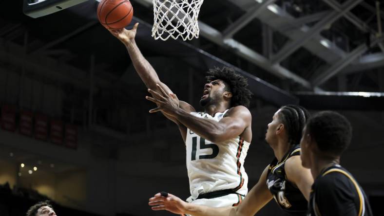 Dec 16, 2023; Coral Gables, Florida, USA; Miami Hurricanes forward Norchad Omier (15) lays up a shot against the La Salle Explorers during the second half at Watsco Center. Mandatory Credit: Sam Navarro-USA TODAY Sports