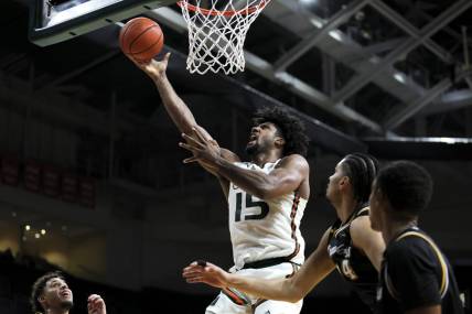 Dec 16, 2023; Coral Gables, Florida, USA; Miami Hurricanes forward Norchad Omier (15) lays up a shot against the La Salle Explorers during the second half at Watsco Center. Mandatory Credit: Sam Navarro-USA TODAY Sports