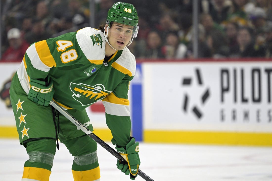 Dec 16, 2023; Saint Paul, Minnesota, USA;  Minnesota Wild defenseman Daemon Hunt (48) gets into position against the Vancouver Canucks during the first period at Xcel Energy Center. Mandatory Credit: Nick Wosika-USA TODAY Sports

