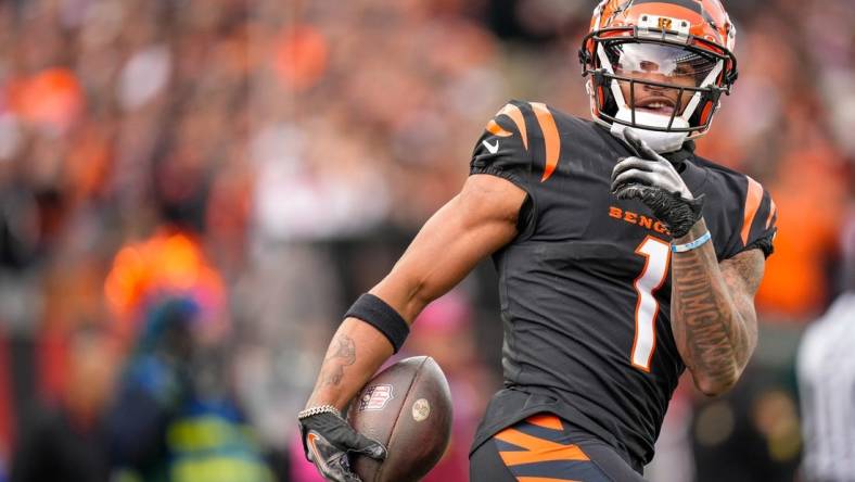 Cincinnati Bengals wide receiver Ja'Marr Chase (1) smiles after completing a deep pass in the first quarter of the NFL Week 15 game between the Cincinnati Bengals and the Minnesota Vikings at PayCor Stadium in downtown Cincinnati on Saturday, Dec. 16, 2023.