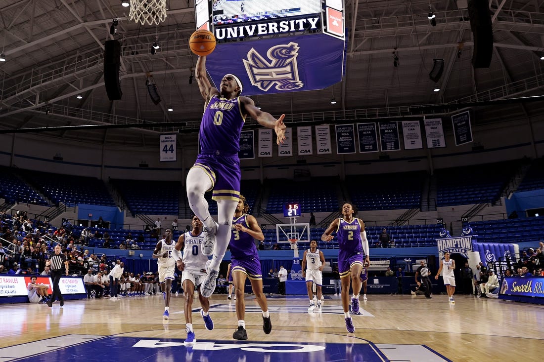 Dec 16, 2023; Hampton, Virginia, USA; James Madison Dukes guard Xavier Brown (0) dunks the ball against the Hampton Pirates during the second half at Hampton Convocation Center. Mandatory Credit: Peter Casey-USA TODAY Sports