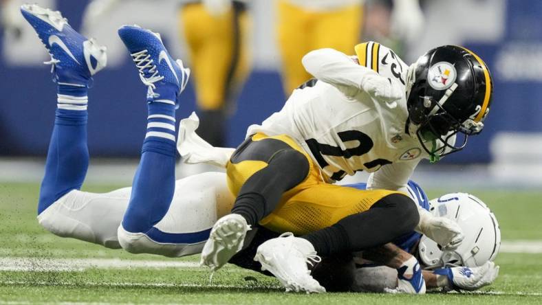 Dec 16, 2023; Indianapolis, Indiana, USA; Indianapolis Colts wide receiver Michael Pittman Jr. (11) collides with Pittsburgh Steelers safety Damontae Kazee (23) during a game against the Pittsburgh Steelers at Lucas Oil Stadium. Mandatory Credit: Robert Scheer-USA TODAY Sports