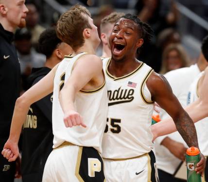 Purdue Boilermakers guard Fletcher Loyer (2) and Purdue Boilermakers guard Lance Jones (55) celebrate during a timeout during the NCAA men   s basketball game against the Arizona Wildcats, Saturday, Dec. 16, 2023, at Gainbridge Fieldhouse in Indianapolis. Purdue Boilermakers won 92-84.