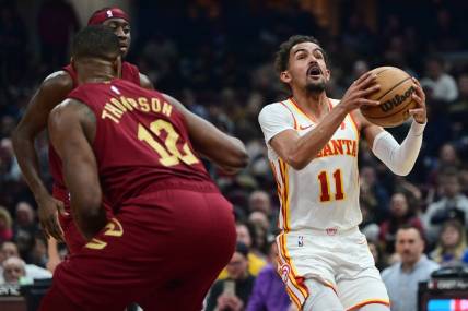 Dec 16, 2023; Cleveland, Ohio, USA; Atlanta Hawks guard Trae Young (11) drives to the basket against the Cleveland Cavaliers during the first half at Rocket Mortgage FieldHouse. Mandatory Credit: Ken Blaze-USA TODAY Sports