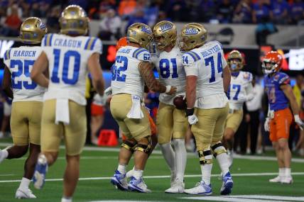 Dec 16, 2023; Inglewood, CA, USA; UCLA Bruins tight end Hudson Habermehl (81) celebrates with teammates after catching a touchdown pass in the first quarter against the Boise State Broncos during the LA Bowl at SoFi Stadium. Mandatory Credit: Kiyoshi Mio-USA TODAY Sports
