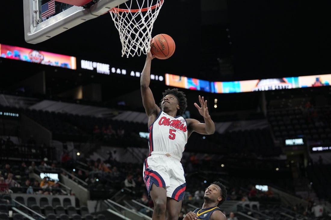 Dec 16, 2023; San Antonio, Texas, USA;  Mississippi Rebels guard Jaylen Murray (5) shoots in the second half against the California Golden Bears at the Frost Bank Center. Mandatory Credit: Daniel Dunn-USA TODAY Sports