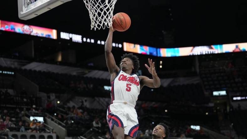 Dec 16, 2023; San Antonio, Texas, USA;  Mississippi Rebels guard Jaylen Murray (5) shoots in the second half against the California Golden Bears at the Frost Bank Center. Mandatory Credit: Daniel Dunn-USA TODAY Sports