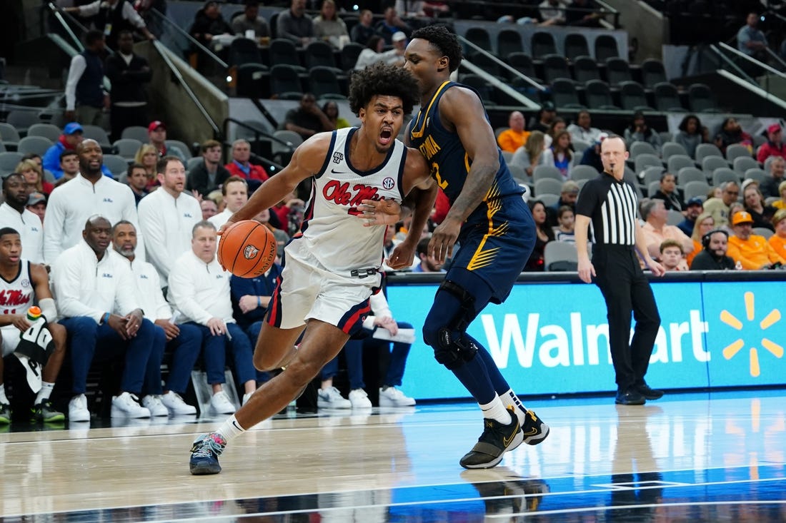 Dec 16, 2023; San Antonio, Texas, USA; Mississippi Rebels forward Jaemyn Brakefield (4) dribbles against California Golden Bears guard Jalen Celestine (32) in the second half at the Frost Bank Center. Mandatory Credit: Daniel Dunn-USA TODAY Sports