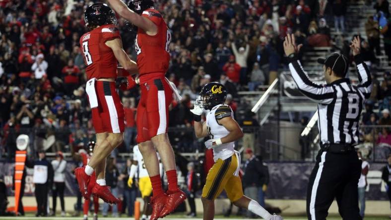 Dec 16, 2023; Shreveport, LA, USA; Texas Tech Red Raiders wide receiver Coy Eakin (8) reacts with tight end Mason Tharp (80) after a touchdown catch during the first half against the California Golden Bears at Independence Stadium. Mandatory Credit: Petre Thomas-USA TODAY Sports