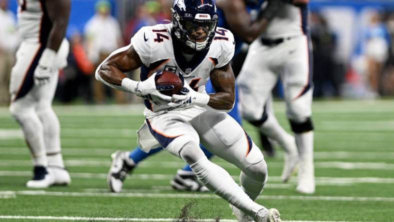 Dec 16, 2023; Detroit, Michigan, USA; Denver Broncos wide receiver Courtland Sutton (14) runs with the ball against the Detroit Lions in the third quarter at Ford Field. Mandatory Credit: Lon Horwedel-USA TODAY Sports