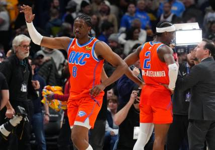 Dec 16, 2023; Denver, Colorado, USA; Oklahoma City Thunder forward Jalen Williams (8) and guard Shai Gilgeous-Alexander (2) celebrate after defeating the Denver Nuggets at Ball Arena. Mandatory Credit: Ron Chenoy-USA TODAY Sports