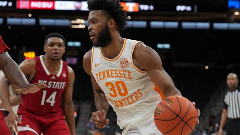 Dec 16, 2023; San Antonio, Texas, USA;  Tennessee Volunteers guard Josiah-Jordan James (30) dribbles in the second half against the North Carolina State Wolfpack at the Frost Bank Center. Mandatory Credit: Daniel Dunn-USA TODAY Sports