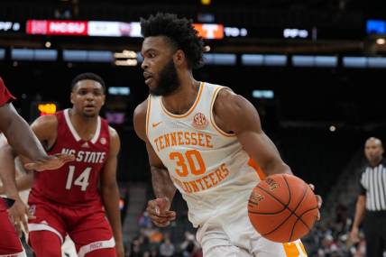 Dec 16, 2023; San Antonio, Texas, USA;  Tennessee Volunteers guard Josiah-Jordan James (30) dribbles in the second half against the North Carolina State Wolfpack at the Frost Bank Center. Mandatory Credit: Daniel Dunn-USA TODAY Sports