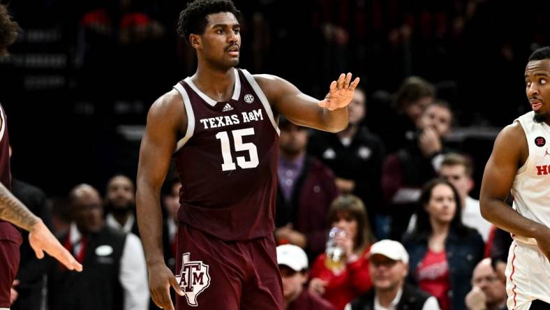 Dec 16, 2023; Houston, Texas, USA; Texas A&M Aggies forward Henry Coleman III (15) motions during a time-out in the second half against the Houston Cougars at Toyota Center. Mandatory Credit: Maria Lysaker-USA TODAY Sports