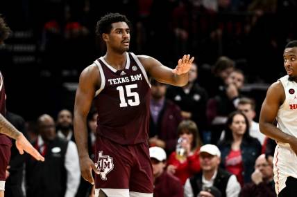 Dec 16, 2023; Houston, Texas, USA; Texas A&M Aggies forward Henry Coleman III (15) motions during a time-out in the second half against the Houston Cougars at Toyota Center. Mandatory Credit: Maria Lysaker-USA TODAY Sports