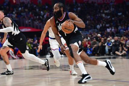 Dec 16, 2023; Los Angeles, California, USA; Los Angeles Clippers guard James Harden (1) moves to the basket against the New York Knicks during the first half at Crypto.com Arena. Mandatory Credit: Gary A. Vasquez-USA TODAY Sports