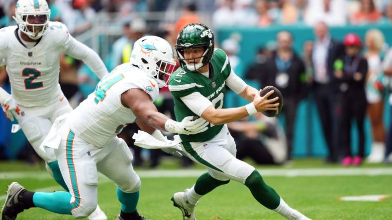 Dec 17, 2023; Miami Gardens, Florida, USA; Miami Dolphins defensive tackle Christian Wilkins (94) rushes in on New York Jets quarterback Zach Wilson (2) during the first half at Hard Rock Stadium. Mandatory Credit: Jasen Vinlove-USA TODAY Sports