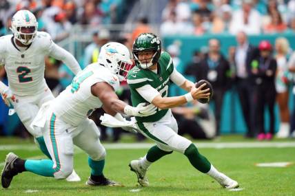 Dec 17, 2023; Miami Gardens, Florida, USA; Miami Dolphins defensive tackle Christian Wilkins (94) rushes in on New York Jets quarterback Zach Wilson (2) during the first half at Hard Rock Stadium. Mandatory Credit: Jasen Vinlove-USA TODAY Sports