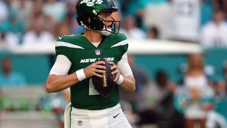 Dec 17, 2023; Miami Gardens, Florida, USA; New York Jets quarterback Zach Wilson (2) drops back to attempt a pass against the Miami Dolphins during the first half at Hard Rock Stadium. Mandatory Credit: Jasen Vinlove-USA TODAY Sports