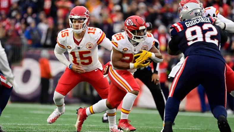 Dec 17, 2023; Foxborough, Massachusetts, USA; Kansas City Chiefs quarterback Patrick Mahomes (15) hands the ball off to running back Clyde Edwards-Helaire (25) during the first half against the New England Patriots at Gillette Stadium. Mandatory Credit: Eric Canha-USA TODAY Sports