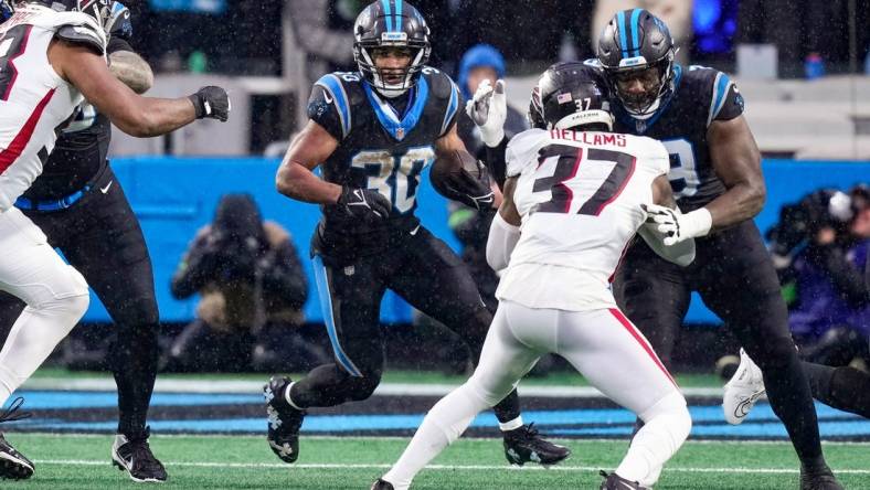 Dec 17, 2023; Charlotte, North Carolina, USA; Carolina Panthers running back Chuba Hubbard (30) runs the ball against the Atlanta Falcons during the second quarter at Bank of America Stadium. Mandatory Credit: Jim Dedmon-USA TODAY Sports