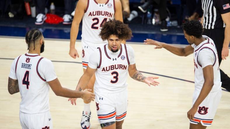 Auburn Tigers guard Tre Donaldson (3) reacts after drawing a foul as Auburn Tigers take on USC Trojans at Neville Arena in Auburn, Ala., on Sunday, Dec. 17, 2023. Auburn Tigers defeated USC Trojans 91-75.