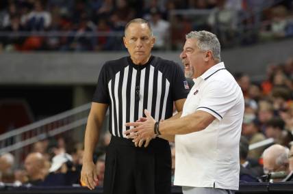 Dec 17, 2023; Auburn, Alabama, USA;  Auburn Tigers head coach Bruce Pearl talks to a game official during the second half against the USC Trojans at Neville Arena. Mandatory Credit: John Reed-USA TODAY Sports