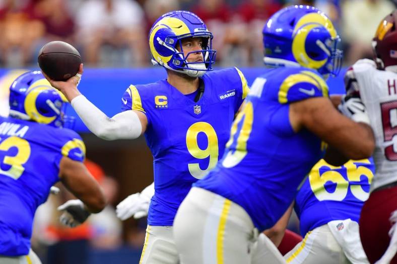 Dec 17, 2023; Inglewood, California, USA; Los Angeles Rams quarterback Matthew Stafford (9) throws against the against the Washington Commanders during the first half at SoFi Stadium. Mandatory Credit: Gary A. Vasquez-USA TODAY Sports
